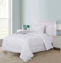 Jazlin quilted microfibre comforter set on a twin bed