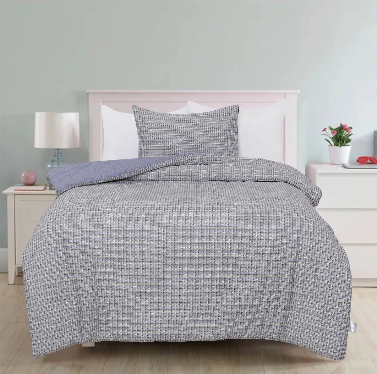 Ludovic comforter styled with its sham