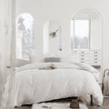 Arnaud quilted microfibre duvet cover set on a made bed