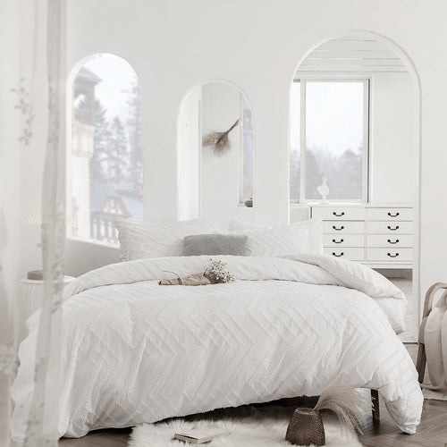Arnaud quilted microfibre duvet cover set on a made bed