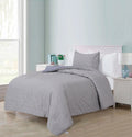 Ludovic quilted cotton comforter set on a twin bed