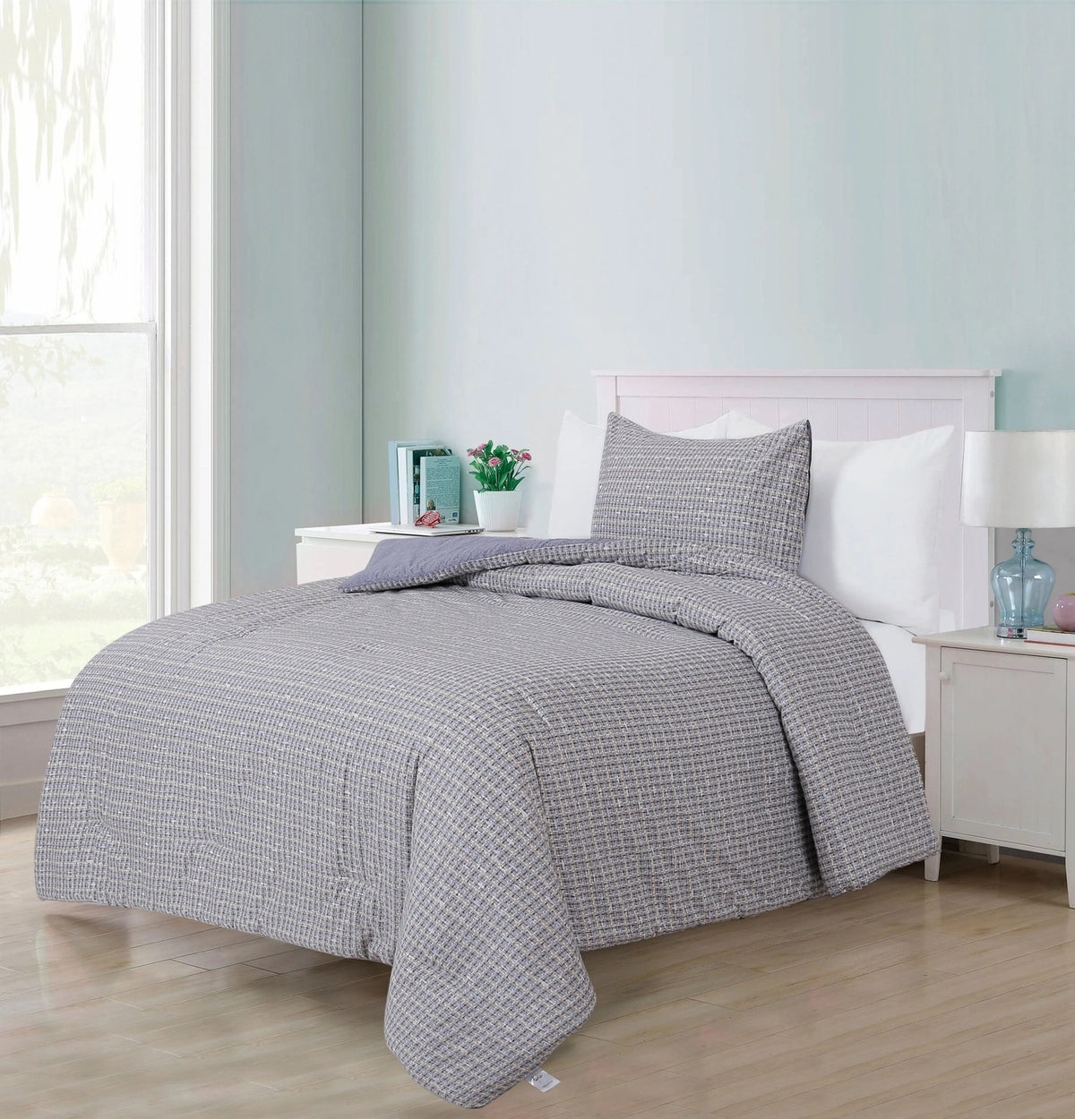 Ludovic quilted cotton comforter set on a twin bed