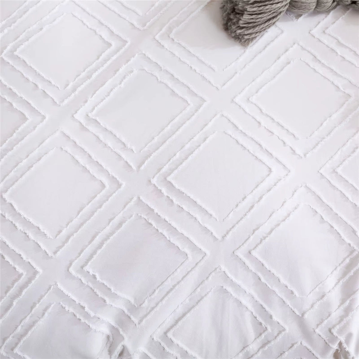 Close-up of the Kate embroidered quilting