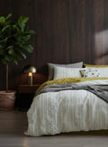 Jade textured cotton duvet cover set on a made bed