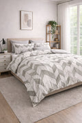 Duke quilted microfibre duvet cover set on a made bed