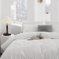 Kate quilted microfibre duvet cover set on a made bed