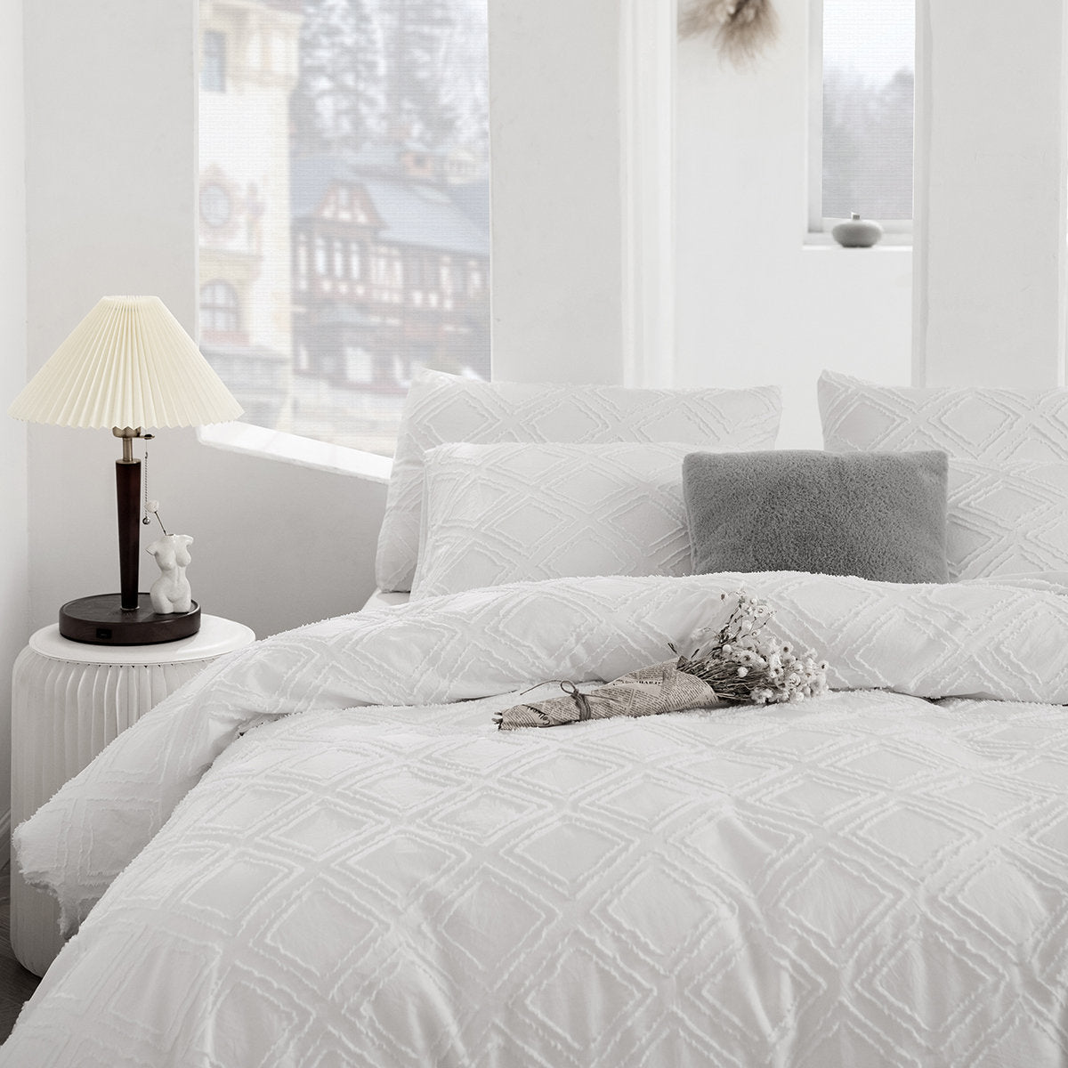 Kate quilted microfibre duvet cover set on a made bed