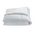 Goose down and feather duvet insert on a bed