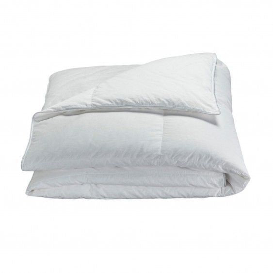 Goose down and feather duvet insert on a bed